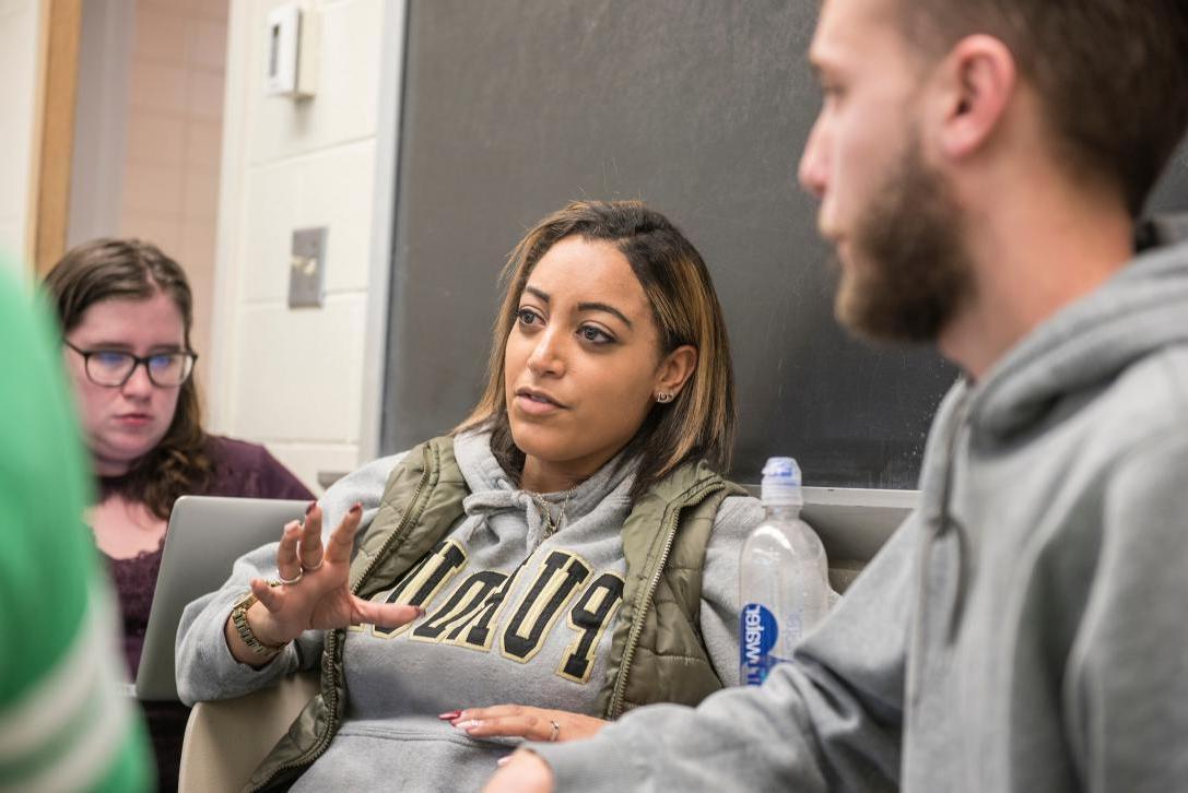 Students exchanging ideas in the classroom.